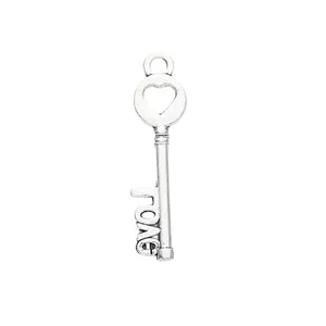 Vintage heart-shaped alloy key pendant with LOVE letter design in antique silver finish