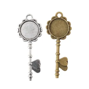 Vintage key-shaped DIY alloy pendants in silver and bronze with round bezel and heart motif
