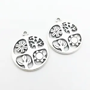 Vintage alloy round four seasons pendant with hollow sun, tree, leaf and snowflake symbols