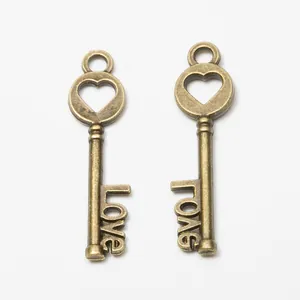 Vintage bronze heart key pendants featuring Love script for DIY jewelry making crafts