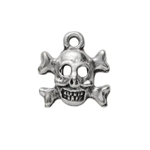 Vintage silver skull and crossbones pendant with ring loop for DIY jewelry making
