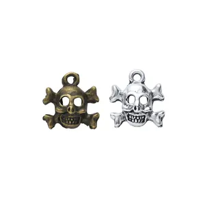 Vintage zinc alloy skull and crossbones pendants in bronze and silver finishes
