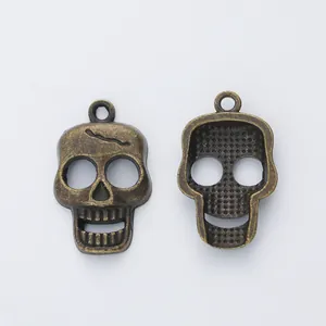 Vintage bronze skull charms with detailed relief and back texture for DIY jewelry making