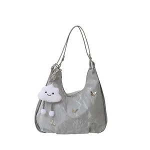 Gray large capacity tote bag with gold butterfly accents and cloud charm in minimalist style