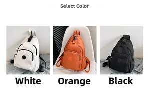 Nylon borsttas in wit, oranje en zwart met meerdere ritszakken en verstelbare riem