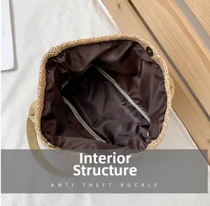 Detailed interior of woven straw beach bag featuring brown lining and anti-theft buckle