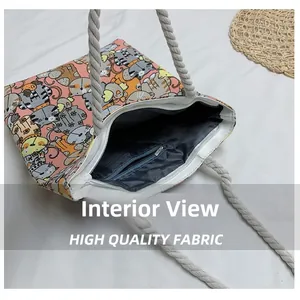 Interior view of cartoon cat tote bag showing zipper pocket and durable lining