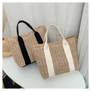 Macro detail of hand-woven straw tote bags with textured weave and canvas ribbon handles