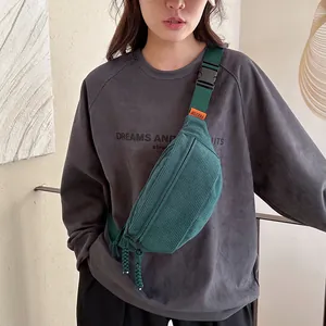 Dark green corduroy crossbody bag with stripe texture and adjustable buckle strap