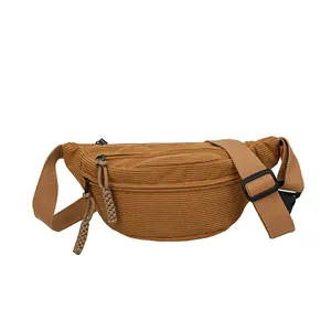 Brown corduroy crossbody waist bag with striped texture and adjustable nylon strap