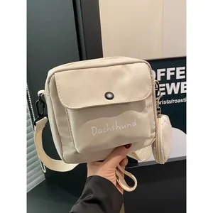 Japanese style cream crossbody bag with dachshund print and matching round coin purse
