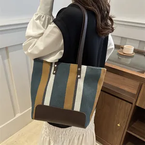 Striped canvas tote bag with leather straps for women, minimalist aesthetic style