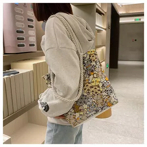 Canvas tote bag with cute yellow cat prints and thick cotton rope handles for women