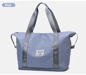 Bolso de viaje azul de gran capacidad con compartimento inferior y asas reforzadas