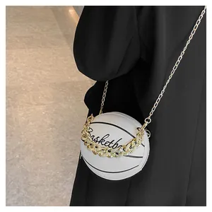 Detail of white mini basketball crossbody bag with gold chain and cursive lettering