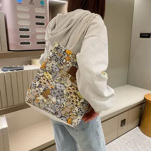 Canvas tote bag with cartoon cat prints and thick rope straps for daily commuting