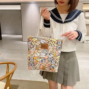 Minimalist canvas tote bag with cat print and rope handles for daily office commute