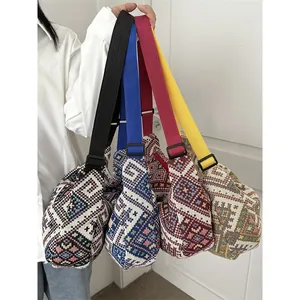 Ethnic jacquard crossbody bag with geometric diamond patterns and adjustable strap