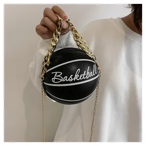 Close-up of black basketball shaped bag with white text and gold chain handle detail