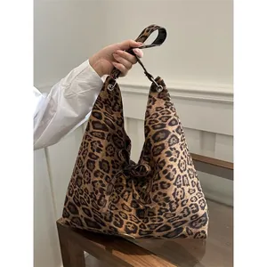 Large leopard print faux suede tote bag with ribbon detail for stylish office commuting