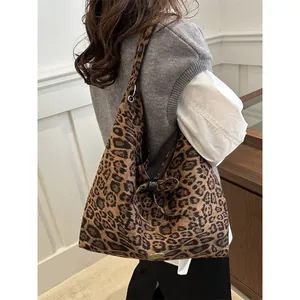 Large vintage leopard print suede tote bag with stylish bow and shoulder strap