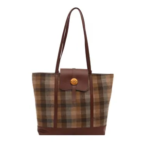Retro striped plaid tote bag with brown leather details and golden N-logo buckle