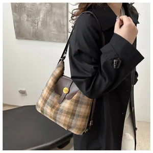 Tweed plaid shoulder bag with brown leather flap and golden N hardware detail