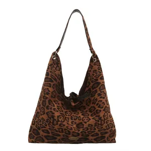 Large leopard print faux suede hobo tote bag with handmade metal tag and shoulder strap