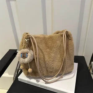 Brown faux fur tote bag with leather handles and cute sheep pendant for autumn and winter