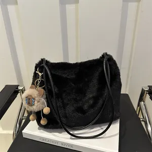 Furry black faux fur tote bag with a cute bear pendant and leather shoulder straps
