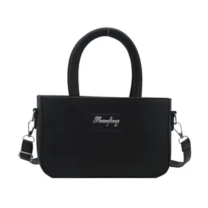 Minimalist black PU leather rectangular crossbody bag with silver hardware and top handle