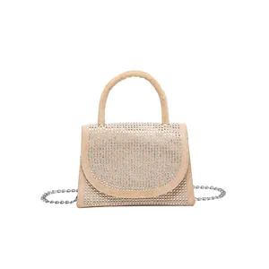 Beige faux suede crossbody bag with sparkling rhinestones and silver chain strap