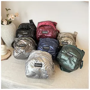 Detailed overhead view of quilted nylon crossbody bags in seven metallic colors