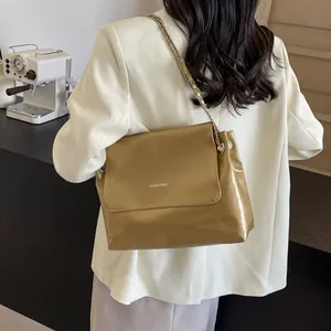 Women's vintage gold metallic chain crossbody bag with white fashion bags text