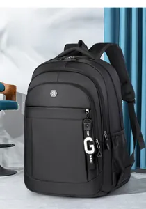 Detail of black nylon backpack featuring multi-layer zippers and side mesh pocket