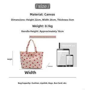 Size guide for strawberry canvas tote bag showing dimensions and storage capacity