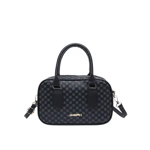 Sac à main noir chic avec motifs circulaires et logo JINGPIN doré sur fond blanc
