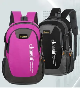 Detail of rose red and black sport backpacks showing durable nylon and side mesh pockets