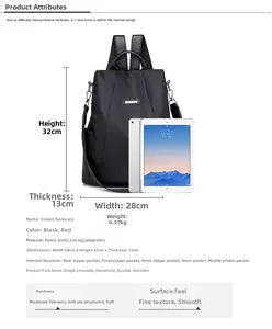 Detail view of black nylon anti-theft backpack showing 28x32x13cm size comparison with iPad