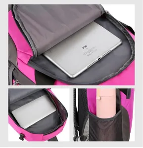 Detail of rose red and grey backpack showing padded tablet compartment and mesh side pocket