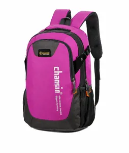 Detail view of pink and grey sports backpack showing mesh side pocket and padded straps