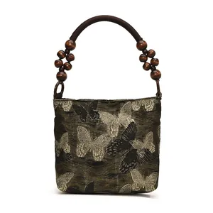 Sac sous le bras perlé style néo-chinois avec broderie papillon et poignées en bois