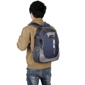 Detail of blue outdoor backpack showing padded shoulder straps and side mesh pocket