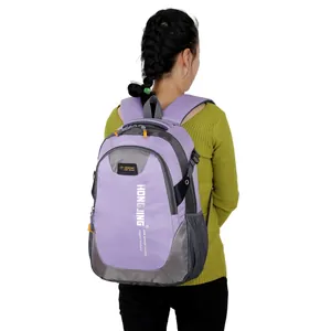 Rear view of large purple and grey backpack with padded straps on a model