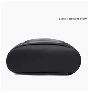 Detailed bottom view of black waterproof nylon backpack showing reinforced stitching