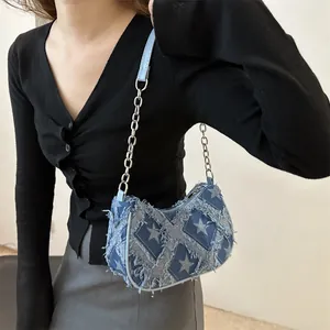 Denim star pattern shoulder bag with frayed edges and silver chain strap for women