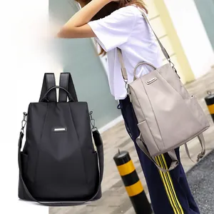 Detailed comparison of black and khaki nylon backpacks with metal logo and side pockets