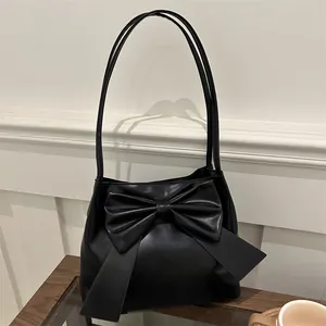 Elegant black PU leather shoulder bag with oversized bow design for modern women