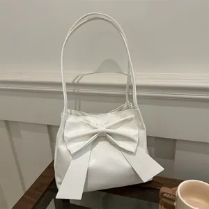 Elegant white bow shoulder bag in premium matte faux leather for women's daily commute