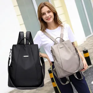 Black and beige nylon anti-theft backpack with waterproof fabric and versatile straps